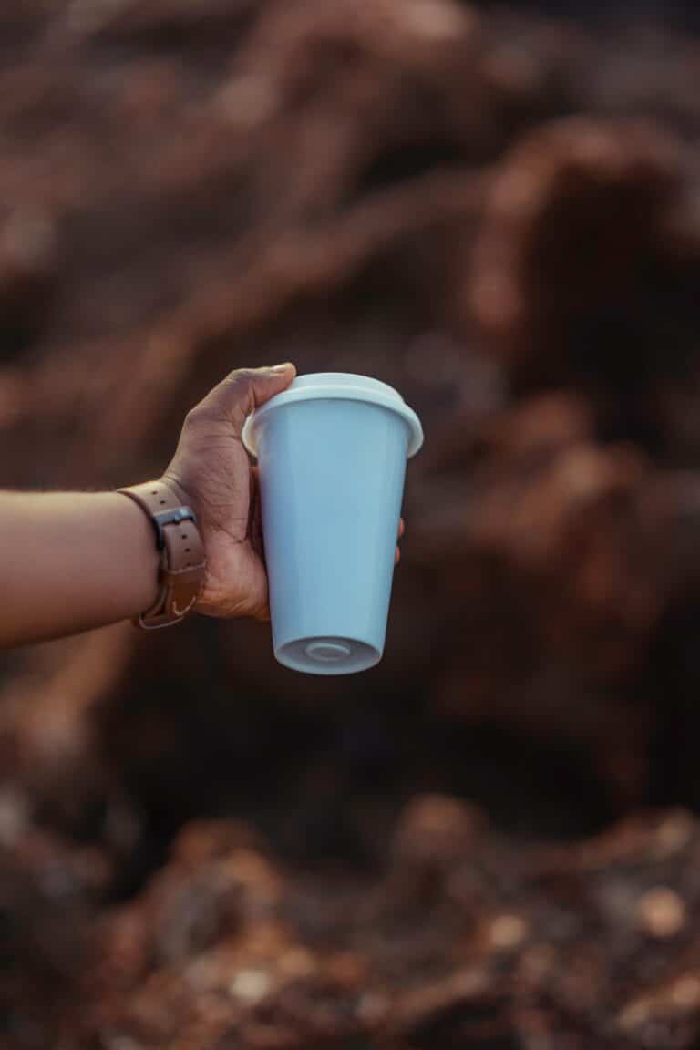 Hand holding a sustainable mug